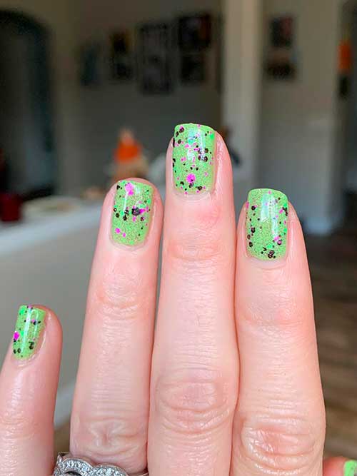 Orly Wild Card Confetti Topper Short Green Spooky nails with Orly Wild Card Confetti Topper from Kelli Marissa Witching Hour Collection