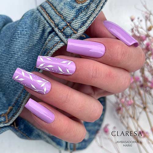 Long square shaped Purple spring nails with white leaf nail art on two accent nails