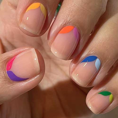 Short minimal nails using colorful petal nail art design above cuticles