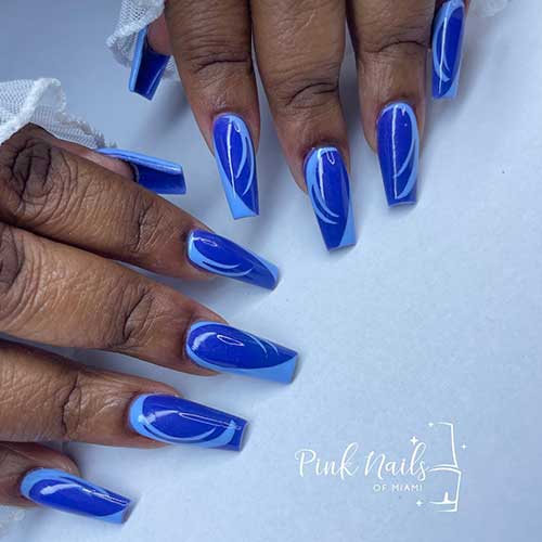 Long coffin Baby blue abstract nail art on dark blue nails
