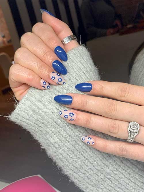 Short almond denim blue summer nails with flowers on nude accent nails