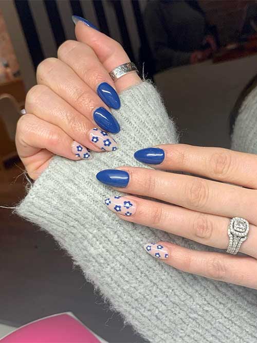 Short almond denim blue summer nails with flowers on nude accent nails Short almond denim blue summer nails with flowers on nude accent nails