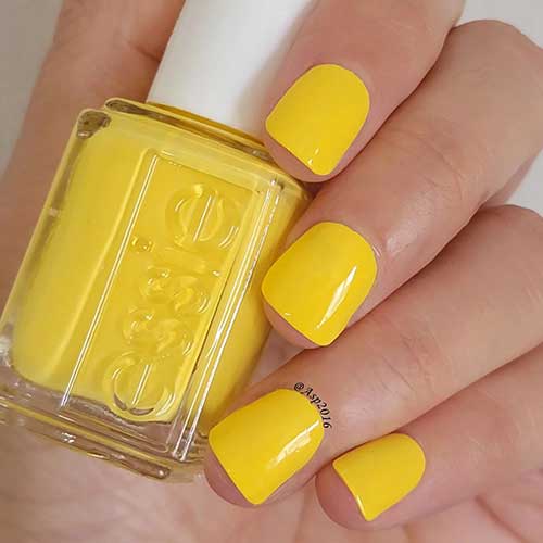 Short bright sunny yellow nails using Essie Sunshine Be Mine from Essie Summer 2023 Collection