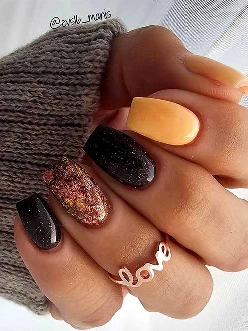 Coffin yellow and black short fall nails adorned with an accent autumn hue glitter nail and a touch of silver glitter Coffin yellow and black short fall nails adorned with an accent autumn hue glitter nail and a touch of silver glitter
