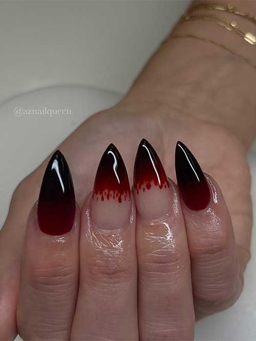 Halloween vampy nails with some blood splatter on two accent French nails Halloween vampy nails with some blood splatter on two accent French nails