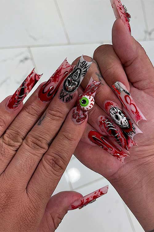 Jason vs. Ghostface Halloween nails feature blood splatters and an eyeball