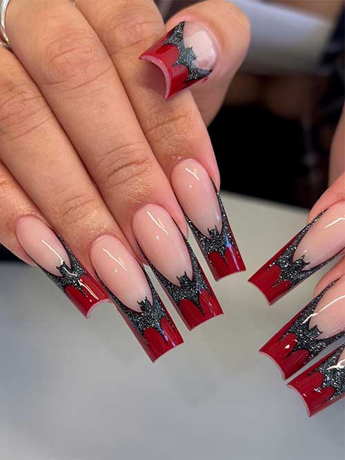 Long dark red French nails with a glitter black bat above each nail tip for Halloween celebration Long dark red French nails with a glitter black bat above each nail tip for Halloween celebration