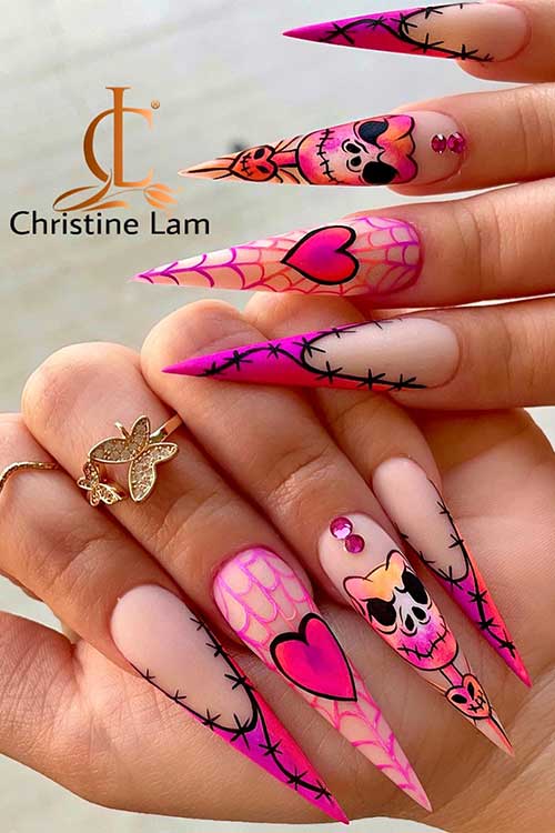 Long stiletto matte French purple and pink Halloween nails over nude base color and feature stitch nail art, and cobwebs