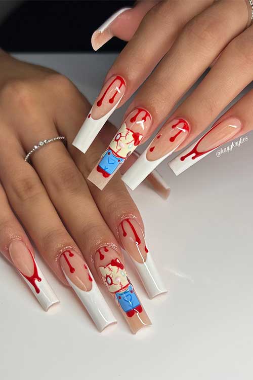 Long white French nails with blood drip nail art and a creepy kitty on an accent nail Long white French nails with blood drip nail art and a creepy kitty on an accent nail