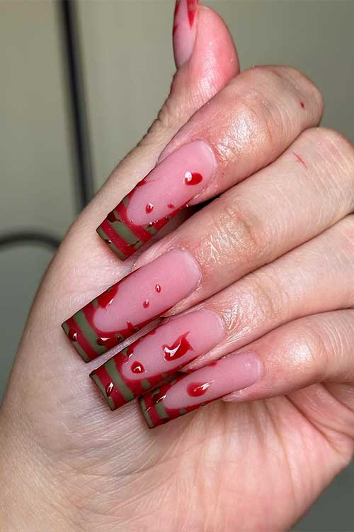 Red and green French Freddy nails with blood drop nail art Red and green French Freddy nails with blood drop nail art