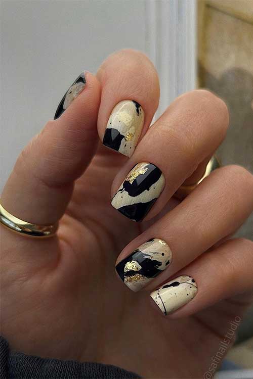 Short black and light beige abstract nails Short black and light beige abstract nails