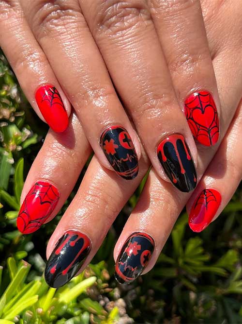 Short red and black nails with cobwebs, and blood nail art