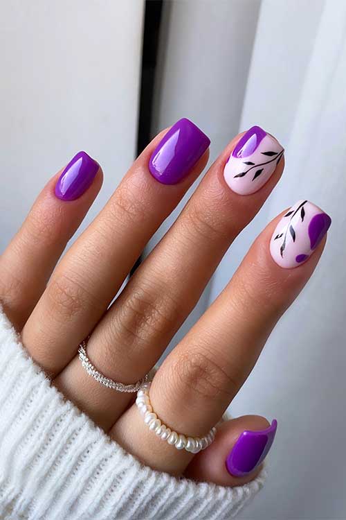 Short square shaped purple fall nails with black leaf nail art on two accent nails.
