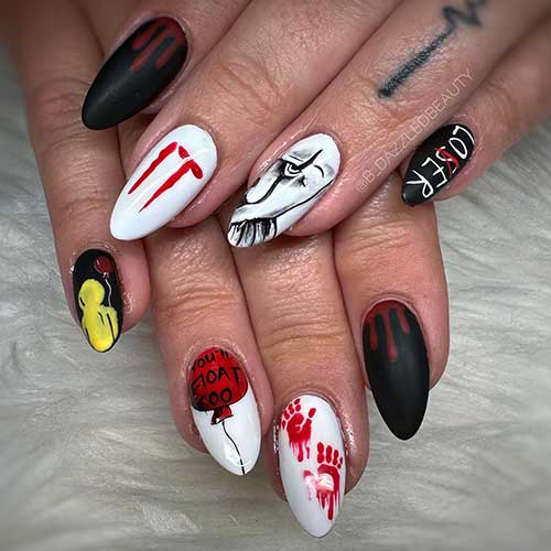 Black and white IT nails with a spooky face, bloody handprint art, and drip nail art
