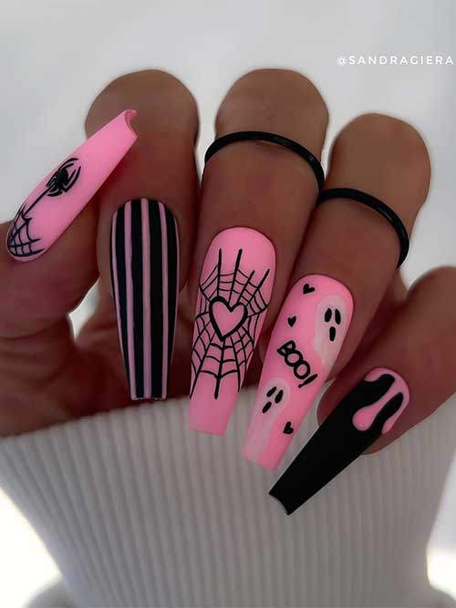 Long coffin-shaped matte pink and black Halloween nails with cobwebs, ghosts, striped nail art, and drip nail art