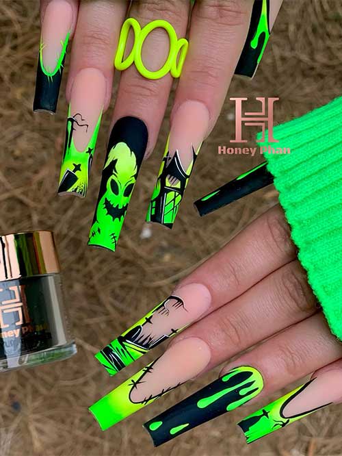 Long square-shaped French oogie boogie man nails with cemetery nail art and green drip nail art over black accent nails. Long square-shaped French oogie boogie man nails with cemetery nail art and green drip nail art over black accent nails.