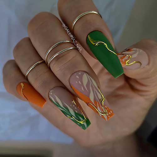Matte coffin green and burnt orange fall season nails adorned with off-white leaf nail art and gold metallic swirl nail art