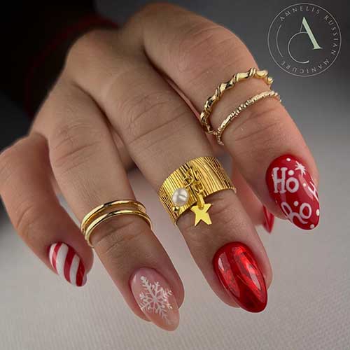 A short red Christmas nail design features a white snowflake on an accent nude nail, a candy cane nail, and a white “Ho” word