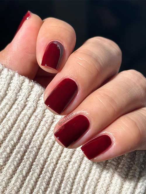 Essie Full Blast it’s a rich ruby red vegan nail polish with blue undertones from the Essie Fall 2023 collection