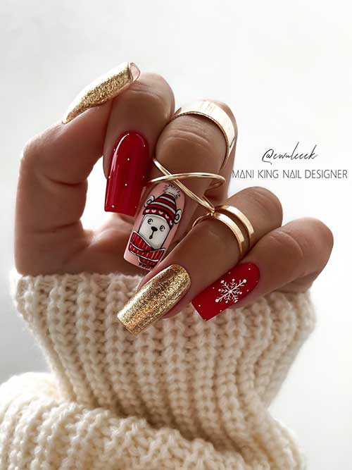 Red and gold Christmas nails feature white dots and a snowflake, gold glitter, and a nude pink accent nail with a polar bear