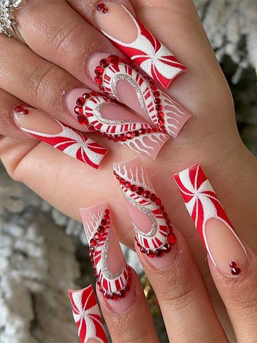 red white candy cane French Christmas nails with big heart-shaped features candy cane, silver glitter, and red rhinestones