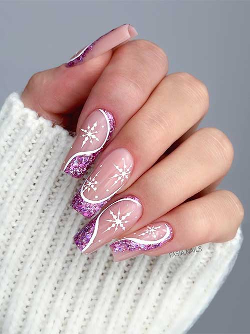 Glitter pink and white negative space swirl winter nails with white snowflakes over the nude base areas