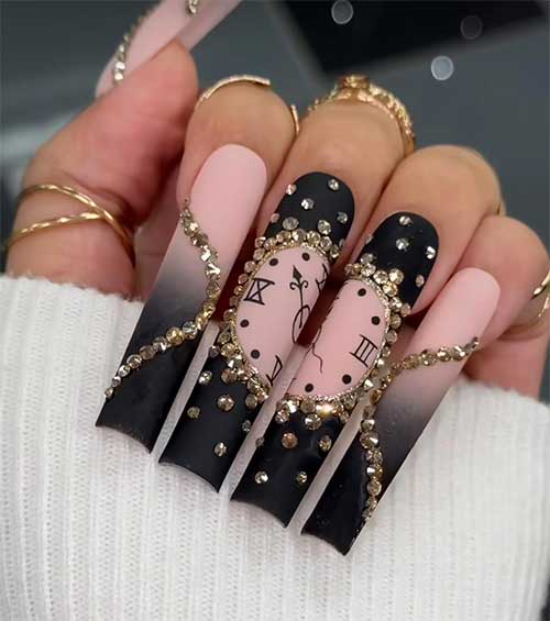 Long matte black New Year's nails feature a nude clock nail art on two accent black nails adorned with gold rhinestones