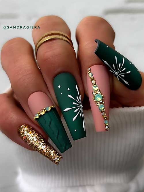 Matte dark green winter coffin nails adorned with white snowflakes and gold rhinestones. Besides, a gold glitter accent nail
