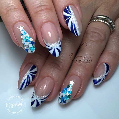 White and blue candy cane Xmas nails with a touch of silver glitter, a blue and white big glitter Christmas tree accent