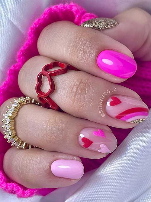 Cute short-length hot and light pink with gold glitter accent nail design adorned with pink and red heart shapes