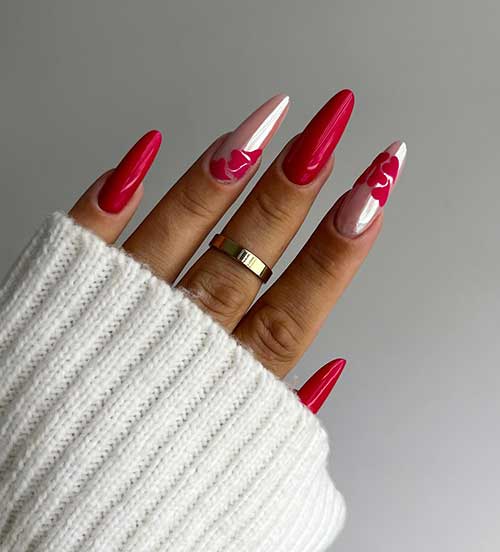 Glossy Long almond-shaped red nails with two accent pearl pink nails adorned with a red heart pattern design