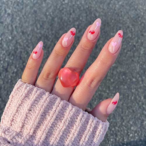 Gorgeous nude Valentine’s Day nails with pink heart and red lips lollipop nail art designs