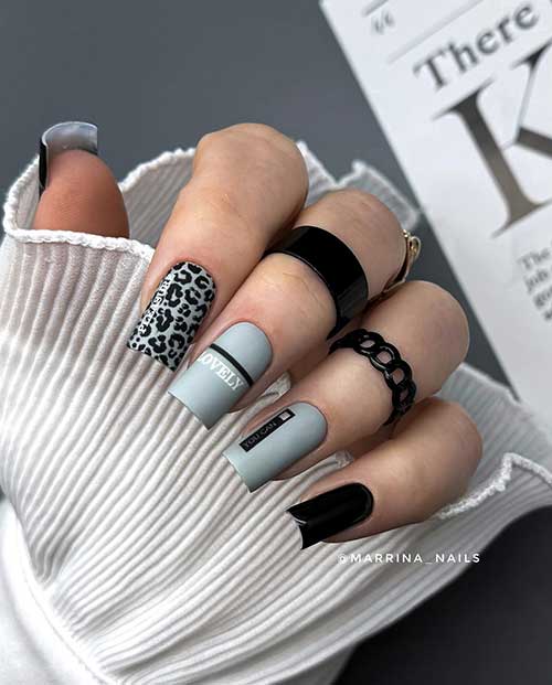 Grey and black nail design features short matte gray nails with black leopard animal prints and two black nails