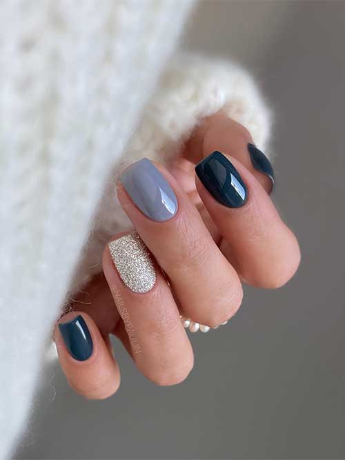 Short charcoal grey nails with an accent light grey nail and a light gold glitter nail are one of the cutest grey nail ideas