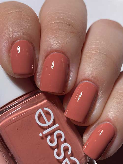 Short coral nails using Essie Never Basic nail polish from Essie Odd Squad Collection