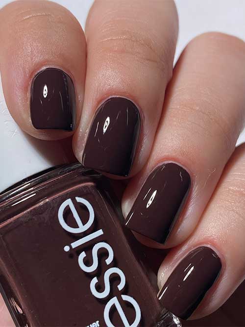 Short rich coffee brown nails using Essie Odd Squad nail polish from Essie Odd Squad Collection