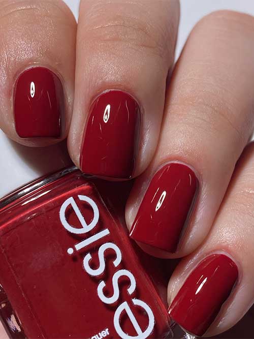 Short rich crimson nails using Essie Not a Phase nail polish from Essie Odd Squad Collection