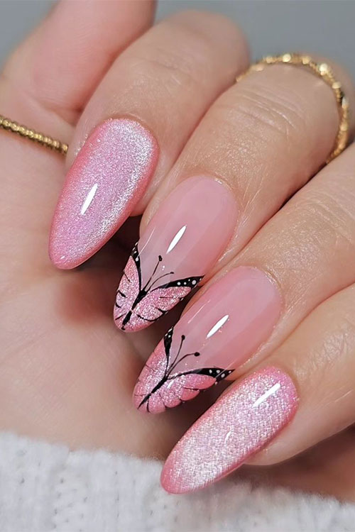 Cute cat eye pink nails almond shaped with two accent pink butterfly French tip nails