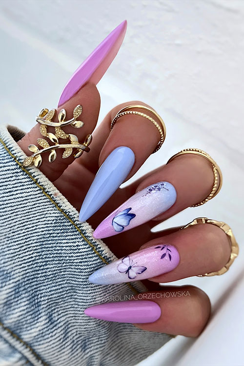 Stunning long almond-shaped pastel blue and purple nails with butterfly nail art design on two accent ombre nails