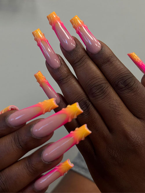 Vibrant ombre French tip nails with a soft nude base, lively pink, and bright orange tips, ideal for a playful summer vibe. Vibrant ombre French tip nails with a soft nude base, lively pink, and bright orange tips, ideal for a playful summer vibe.