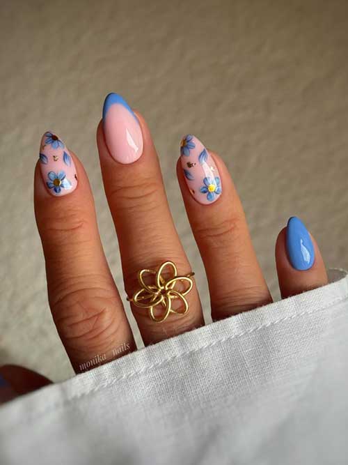 Light blue nail art with pink floral accents and gold flakes, capturing the essence of spring elegance and charm. Light blue nail art with pink floral accents and gold flakes, capturing the essence of spring elegance and charm.