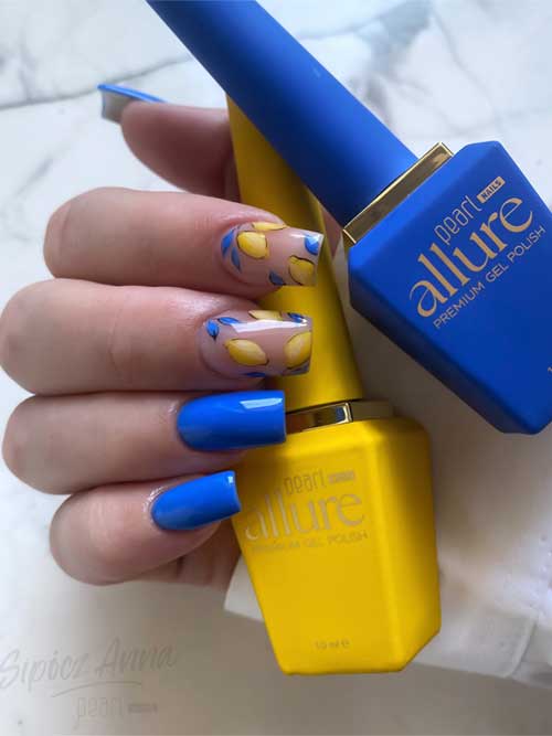 Vibrant blue nails with lemon accents, capturing a playful summer spirit and a refreshing Mediterranean escape. Vibrant blue nails with lemon accents, capturing a playful summer spirit and a refreshing Mediterranean escape.