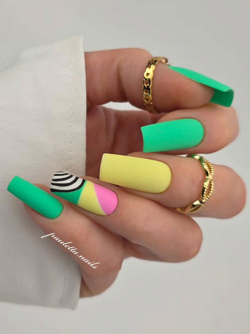 Vibrant green spring nails with nude accents, white floral patterns, and gold embellishments on almond-shaped nails. Vibrant green spring nails with nude accents, white floral patterns, and gold embellishments on almond-shaped nails.