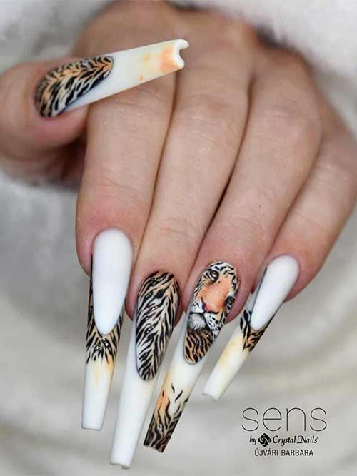 Bold white nails featuring detailed tiger stripes and a captivating tiger face, perfect for making a fearless fashion statement. Bold white nails featuring detailed tiger stripes and a captivating tiger face, perfect for making a fearless fashion statement.