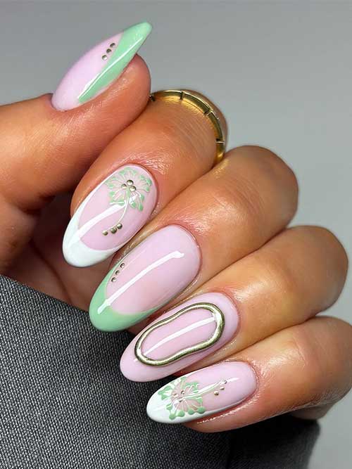 Chic pastel French nails with intricate floral designs and gold accents, offering a stylish look for springtime occasions. Chic pastel French nails with intricate floral designs and gold accents, offering a stylish look for springtime occasions.