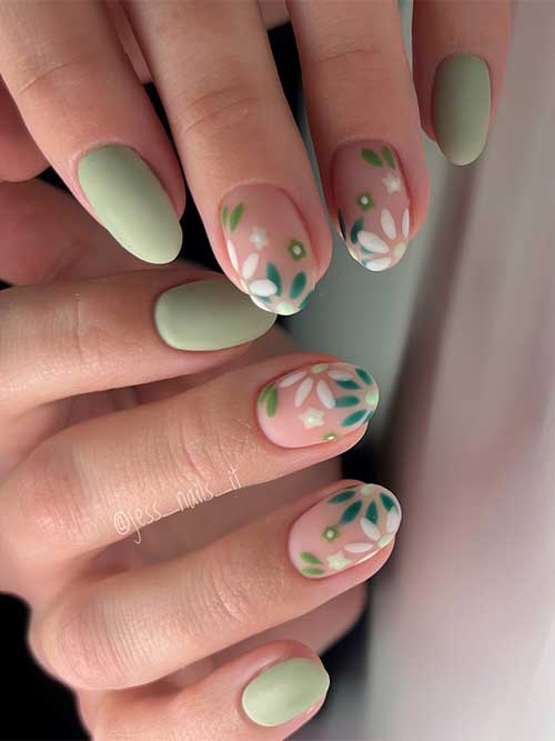 Serene matte, cute green nails with hand-painted white and teal floral patterns. Serene matte, cute green nails with hand-painted white and teal floral patterns.
