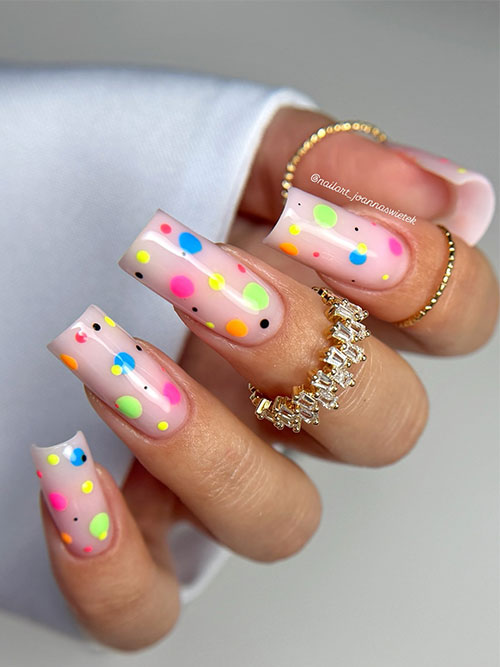 Bright polka dot summer nails on a light pink base, with a mix of neon and pastel colors, adding a fun, modern touch. Bright polka dot summer nails on a light pink base, with a mix of neon and pastel colors, adding a fun, modern touch.
