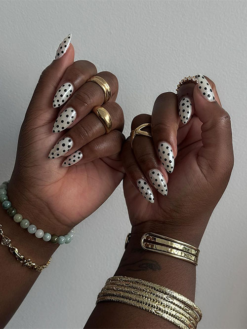 Cute polka dot summer nails with a white background and black dots, offering a chic look for any sunny occasion. Cute polka dot summer nails with a white background and black dots, offering a chic look for any sunny occasion.